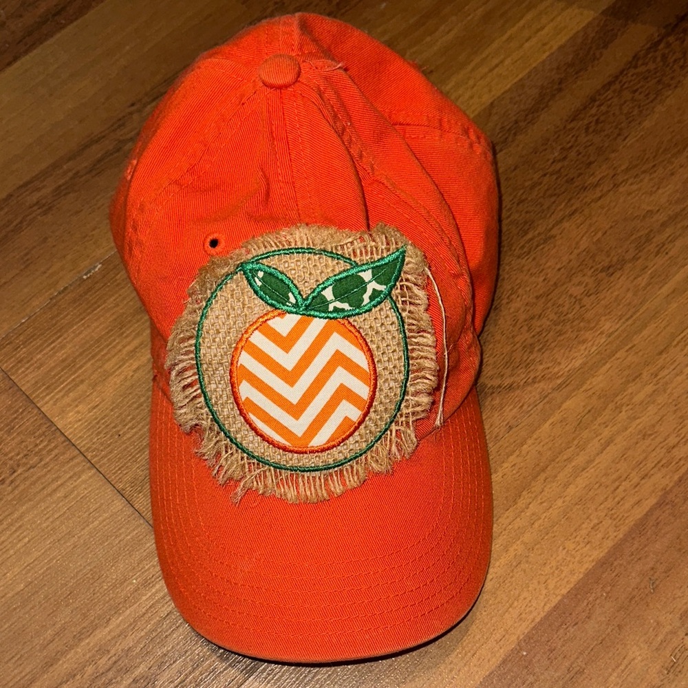 Orange Hat with Chevron Patch and Teal R on the back
